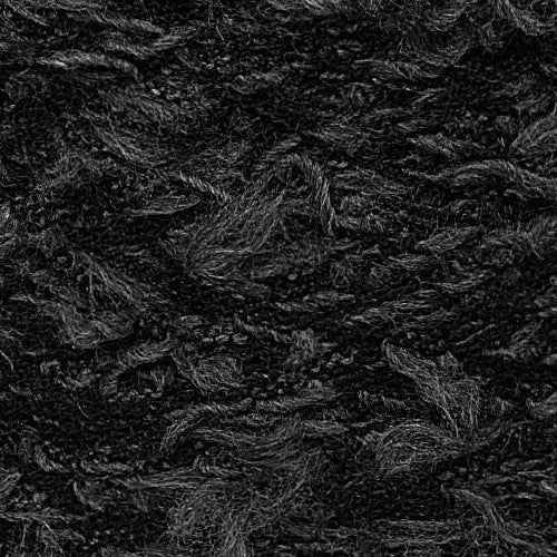 Close-up of Veruchka pikakarvaline efektlõng, a black textured yarn with soft, fuzzy fibers, ideal for cozy projects.